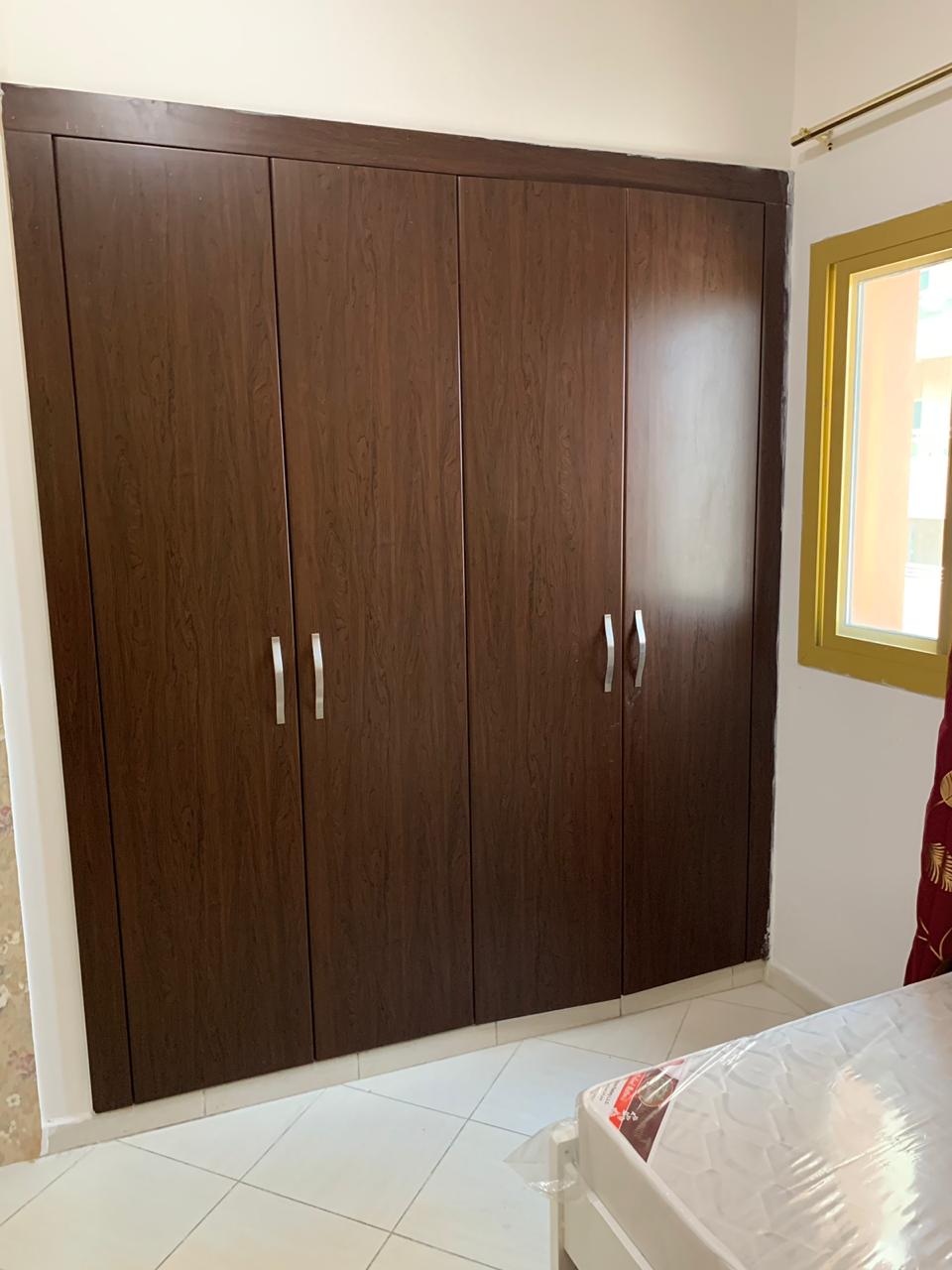 Closed Partition Room Inside Master Bedroom With Window And Big Wardrobe And Sharing Bathroom