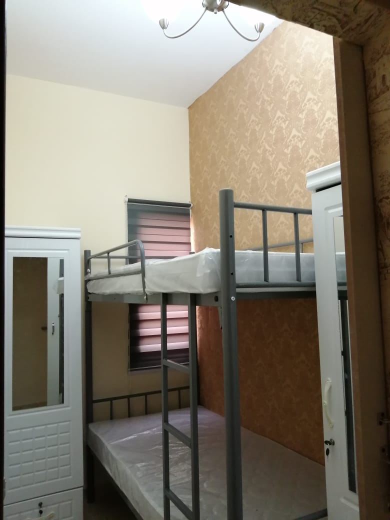 Closed Partition Room With Window, Bunk Bed, And 2 Sharing Bathrooms
